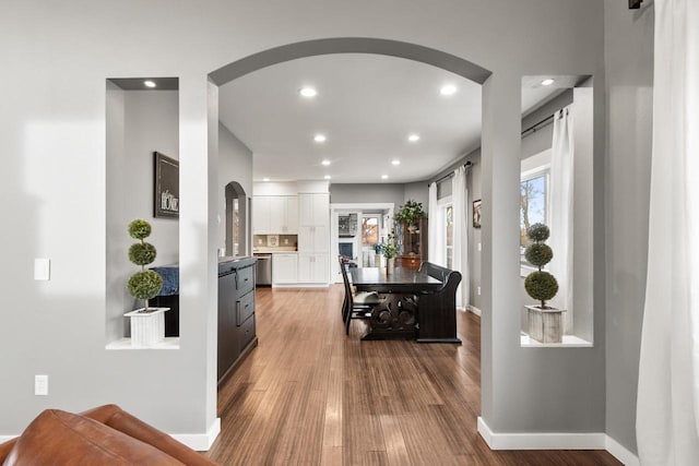 hall with hardwood / wood-style floors