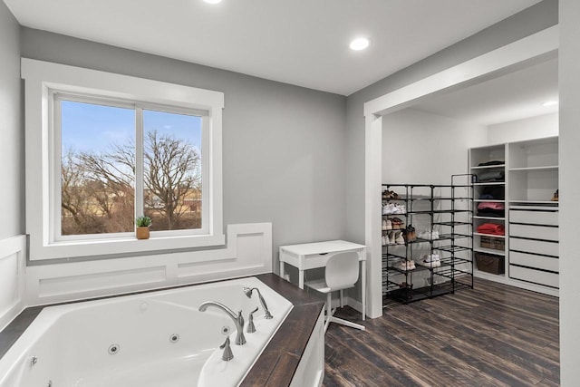 bathroom featuring a tub and hardwood / wood-style flooring