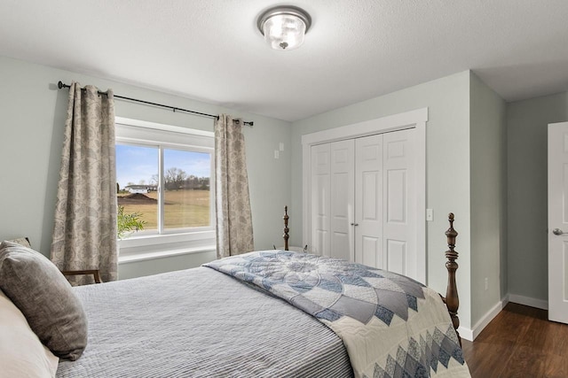 bedroom featuring dark hardwood / wood-style flooring and a closet