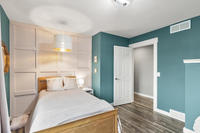 bedroom featuring dark hardwood / wood-style flooring