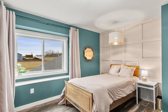 bedroom featuring dark hardwood / wood-style flooring