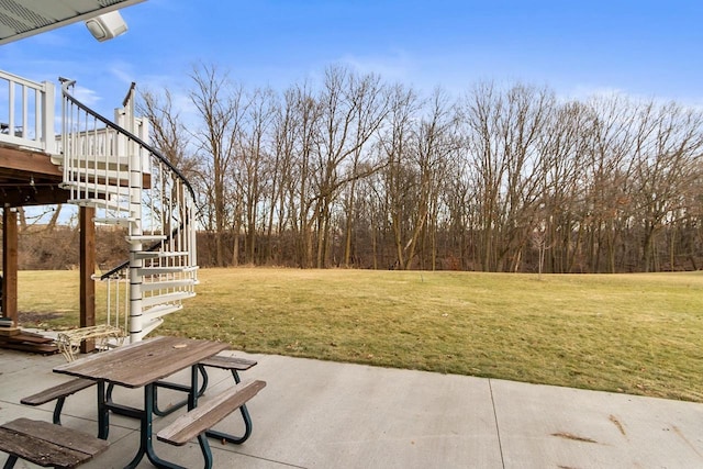 view of yard with a patio area and a wooden deck