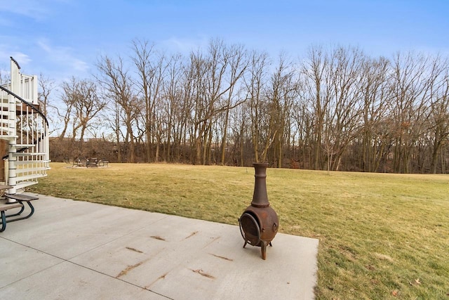 view of yard featuring a patio area and a fire pit