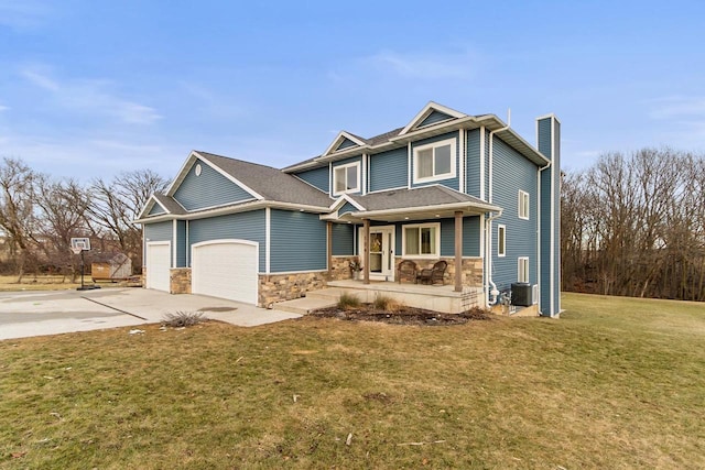 craftsman house with cooling unit, covered porch, and a front yard