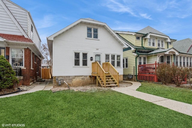 view of front of home featuring a front lawn and a deck