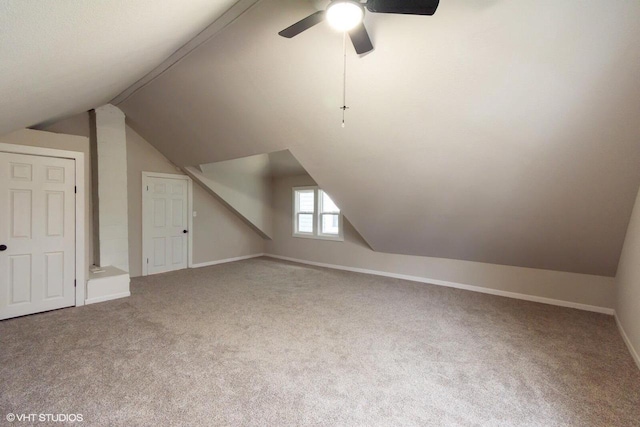 bonus room featuring ceiling fan, carpet floors, and vaulted ceiling