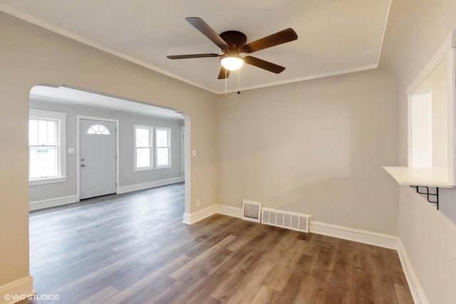 foyer with ceiling fan, ornamental molding, and hardwood / wood-style flooring