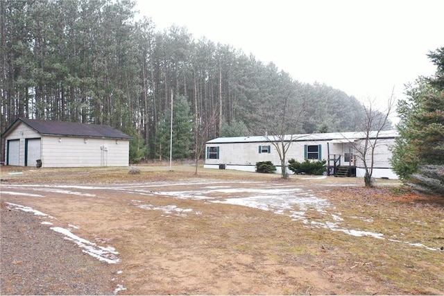 view of front of house with an outbuilding and a garage