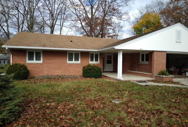 back of house featuring covered porch and a garage