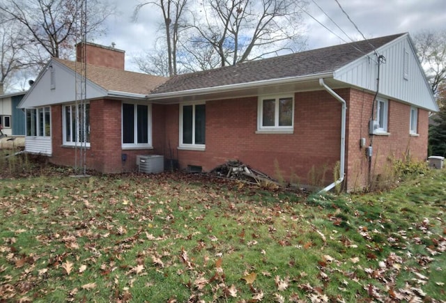 exterior space with a yard and central AC unit