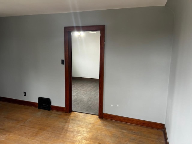 spare room with light hardwood / wood-style flooring