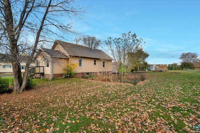 view of property exterior featuring a lawn