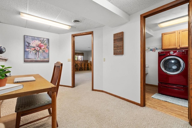 2022 27th St, Monroe, WI 53566 - laundry area featuring light colored carpet, washer / dryer, cabinet space, and visible vents