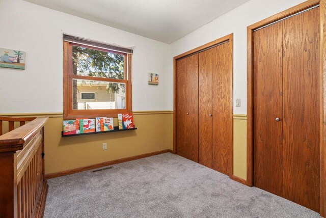2022 27th St, Monroe, WI 53566 - unfurnished bedroom featuring visible vents and carpet floors