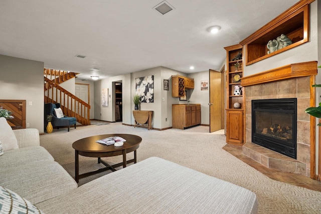 2022 27th St, Monroe, WI 53566 - living room with recessed lighting, stairway, a fireplace, baseboards, and light colored carpet
