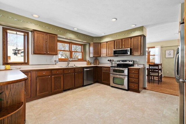 2022 27th St, Monroe, WI 53566 - kitchen with visible vents, recessed lighting, a sink, stainless steel appliances, and light countertops
