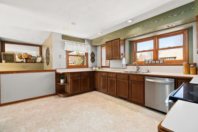 2022 27th St, Monroe, WI 53566 - kitchen featuring visible vents, a sink, light countertops, baseboards, and dishwasher
