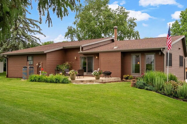 2022 27th St, Monroe, WI 53566 - rear view of property featuring a patio and a yard