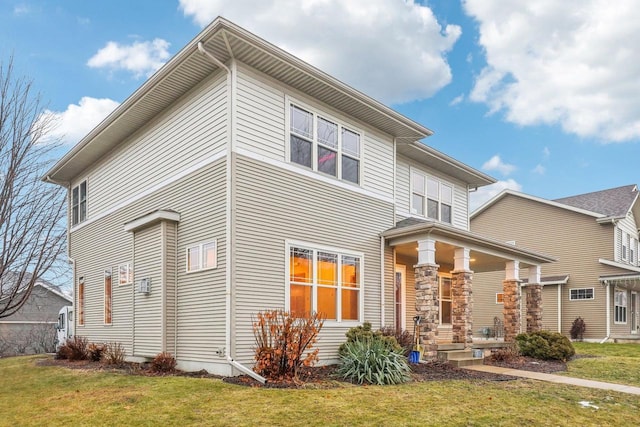 view of front of property with a front yard and a porch