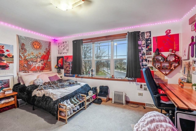 bedroom with carpet flooring and radiator heating unit