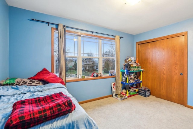 carpeted bedroom with a closet