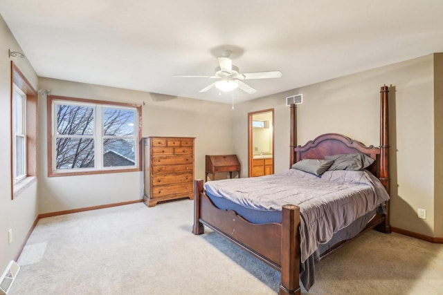 carpeted bedroom featuring connected bathroom and ceiling fan