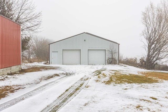 view of snow covered garage