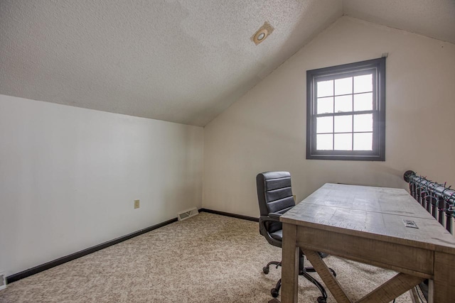 office featuring light carpet, a textured ceiling, and vaulted ceiling