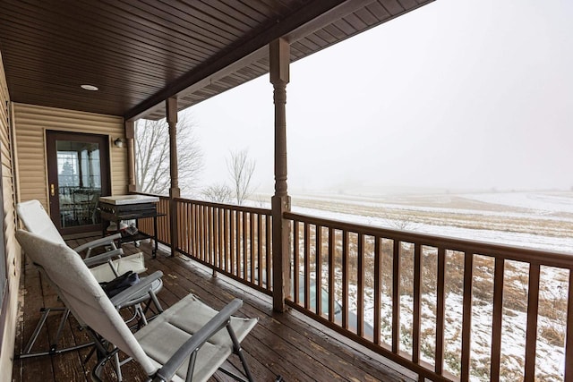 view of snow covered deck