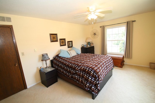 carpeted bedroom featuring ceiling fan