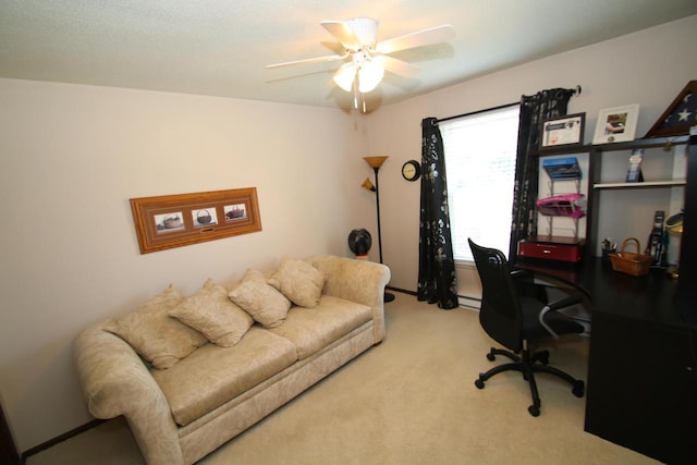 office area with ceiling fan, light colored carpet, and baseboard heating