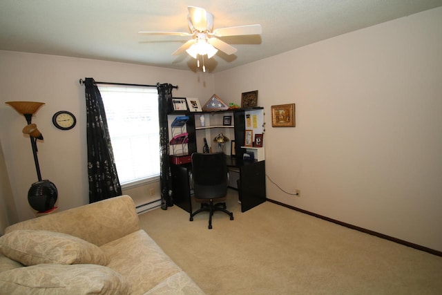 carpeted office with ceiling fan, a healthy amount of sunlight, and a baseboard heating unit