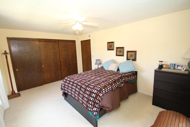 bedroom with light carpet and ceiling fan