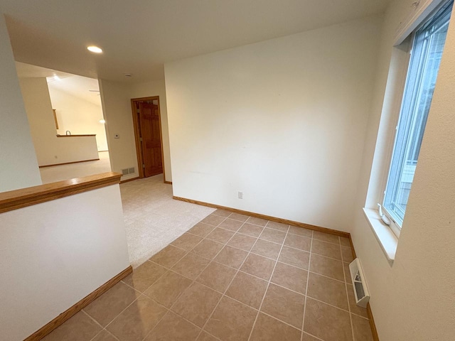 unfurnished room with tile patterned floors