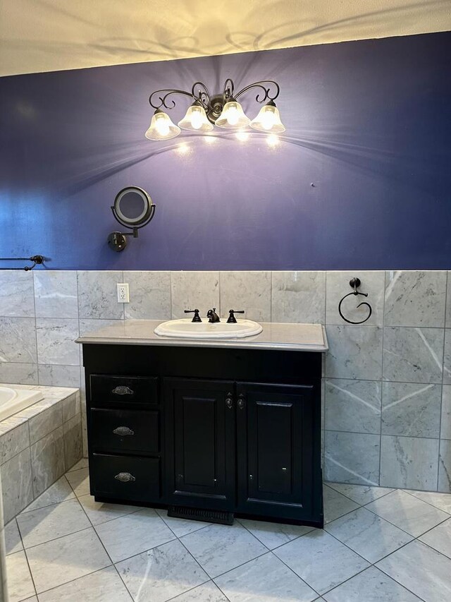 N7859 Lakeside Park Rd, Elkhart Lake, WI 53020 - bathroom with tile walls, vanity, and tiled bath