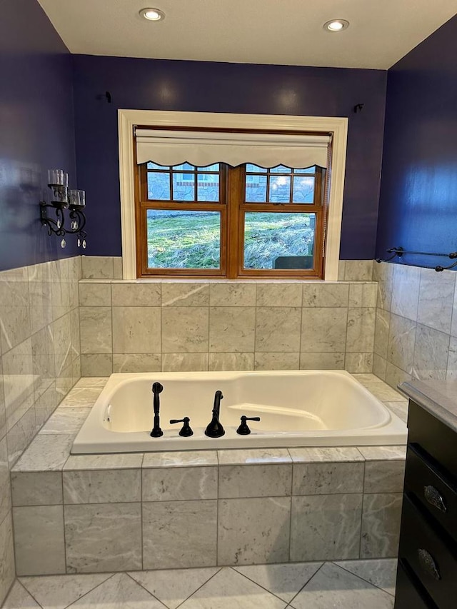 N7859 Lakeside Park Rd, Elkhart Lake, WI 53020 - bathroom with a relaxing tiled tub and tile patterned floors