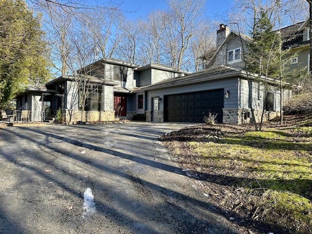 N7859 Lakeside Park Rd, Elkhart Lake, WI 53020 - view of front facade with a garage