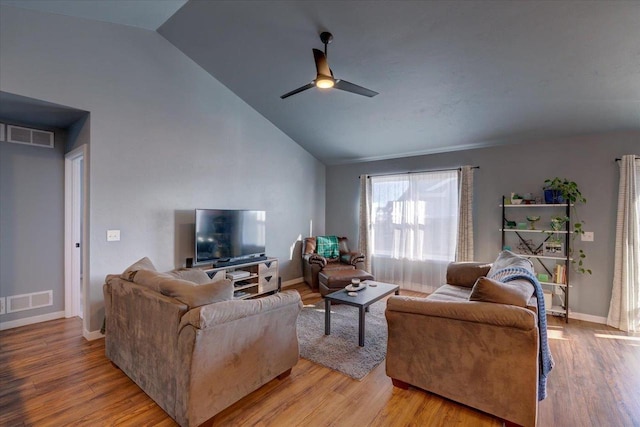 living room with light wood-type flooring, vaulted ceiling, and ceiling fan