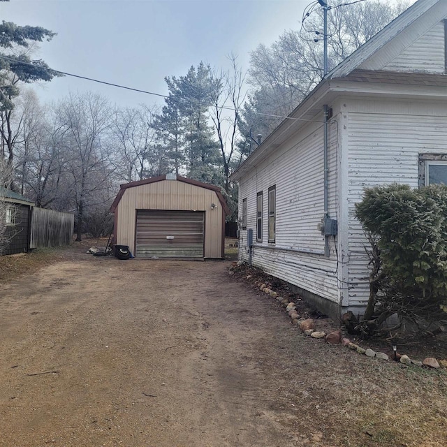 view of home's exterior featuring an outbuilding and a garage