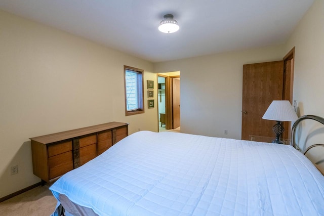 bedroom featuring light carpet