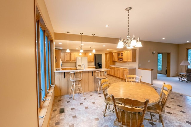 dining area featuring an inviting chandelier