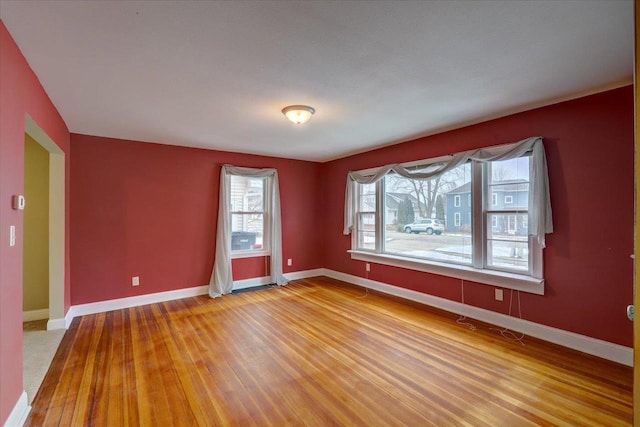 empty room with wood-type flooring