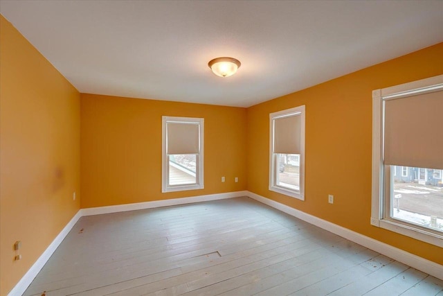 spare room with light hardwood / wood-style floors