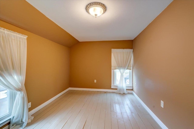 additional living space featuring light wood-type flooring