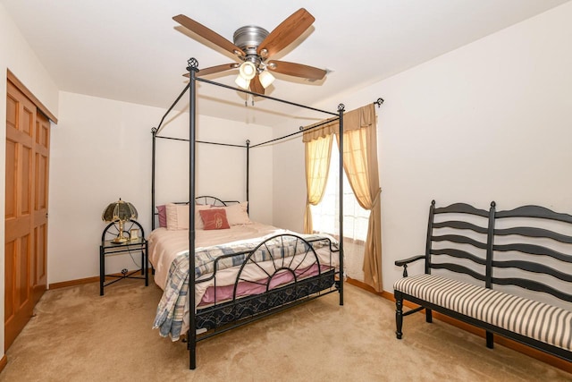 bedroom with light colored carpet and ceiling fan