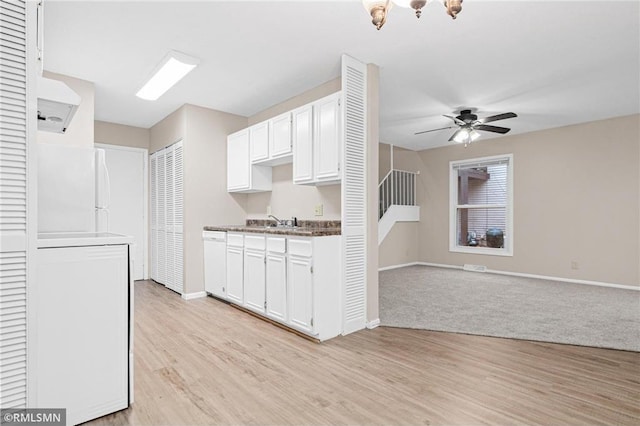 kitchen with ceiling fan, sink, dishwasher, light hardwood / wood-style floors, and white cabinetry