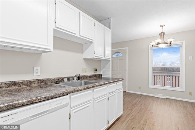 kitchen featuring white cabinetry, dishwasher, sink, an inviting chandelier, and light hardwood / wood-style floors