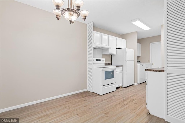 kitchen featuring pendant lighting, white appliances, an inviting chandelier, white cabinets, and washing machine and dryer