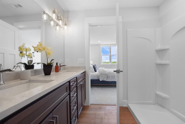 bathroom featuring vanity and hardwood / wood-style flooring