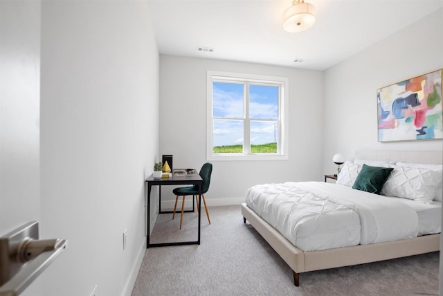 bedroom featuring light carpet